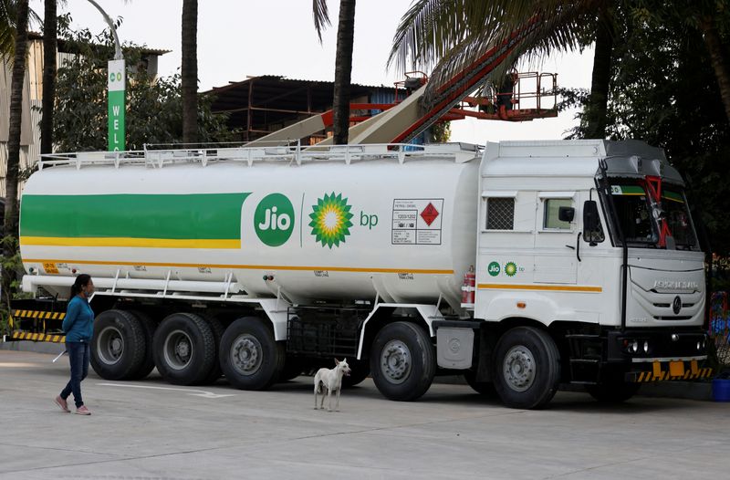 &copy; Reuters. FILE PHOTO: A woman walks past a Jio-bp fuel tanker, an Indian fuel and mobility joint venture between Reliance Industries (RIL) and British Petroleum (BP), fuel station, in Navi Mumbai, India, October 26, 2021 REUTERS/Francis Mascarenhas/File Photo