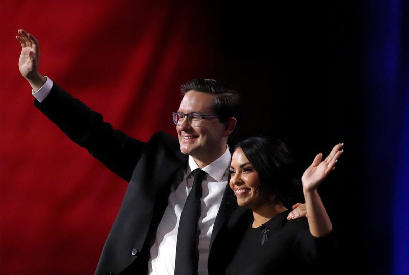 © Reuters. FILE PHOTO: Pierre Poilievre and his wife Anaida celebrate after he is elected as the new leader of Canada's Conservative Party in Ottawa, Ontario, Canada, September 10, 2022. REUTERS/Patrick Doyle/File Photo