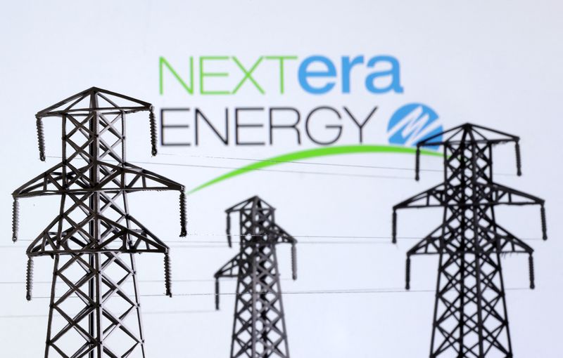 &copy; Reuters. Electric power transmission pylon miniatures and Nextera Energy logo are seen in this illustration taken, December 9, 2022. REUTERS/Dado Ruvic/Illustration