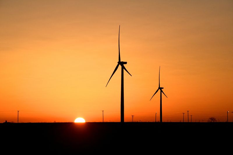 &copy; Reuters. FILE PHOTO: Wind turbines operate at sunrise in the Permian Basin oil and natural gas production area in Big Spring, Texas, U.S., February 12, 2019. REUTERS/Nick Oxford/File Photo