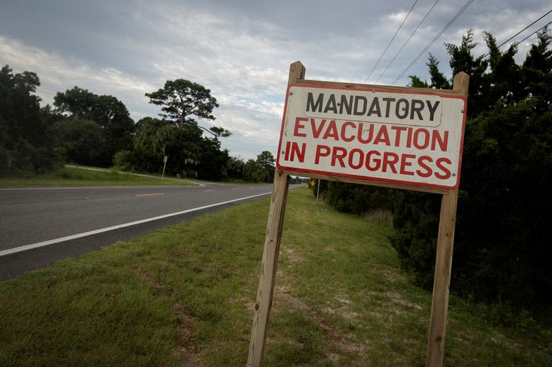 &copy; Reuters. FILE PHOTO: A mandatory evacuation sign is seen ahead of the arrival of Hurricane Idalia, in Cedar Key, Florida, U.S., August 29, 2023. REUTERS/Marco Bello/File Photo