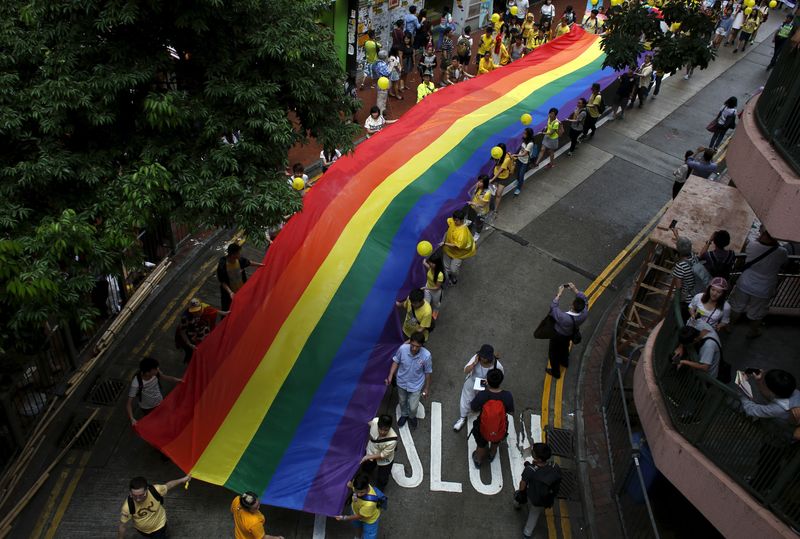 &copy; Reuters. FILE PHOTO: Participants march with a banner with rainbow colours during the annual pride parade in Hong Kong, China, November 7, 2015. REUTERS/Bobby Yip/File Photo