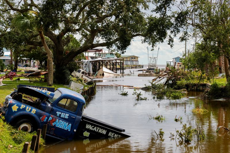 &copy; Reuters. A view of a vehicle partially submerged in a canal after the arrival of Hurricane Idalia in Horseshoe Beach, Florida, U.S., August 30, 2023. REUTERS/Cheney Orr