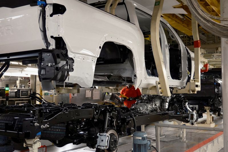 &copy; Reuters. A worker uses a robot to place a Tundra body onto its frame at Toyota's truck plant in San Antonio, Texas, U.S. April 17, 2023. REUTERS/Jordan Vonderhaar
