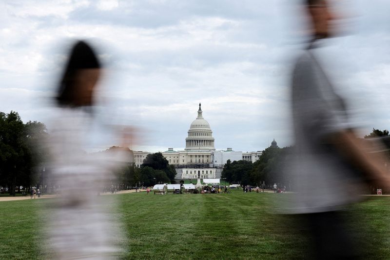 &copy; Reuters. FILE PHOTO: People walk at the National Mall in front of the Capitol in Washington, U.S. August 29, 2023. REUTERS/Kevin Wurm/File Photo