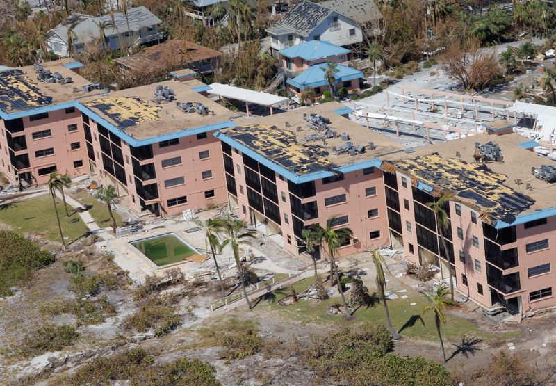 &copy; Reuters. FILE PHOTO: Damaged rooftops of a Fort Myers apartment complex are seen from a U.S. Army National Guard helicopter as U.S. National Guard Bureau Chief General Daniel Hokanson tours the area by air after Hurricane Ian caused widespread destruction in Fort 
