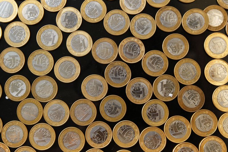 &copy; Reuters. Brazilian real coins are seen in this picture illustration taken in Rio de Janeiro October 15, 2010. Brazil's real crept up to a two-year high in thin trading on Monday as speculation grew that the Federal Reserve is about to pump more money into the stru