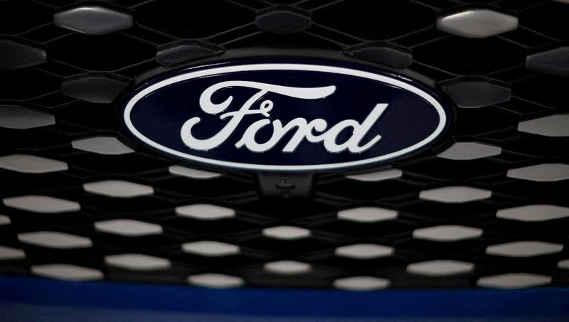&copy; Reuters. FILE PHOTO: The Ford logo is seen on the grill of an E-transit concept vehicle at the Ford Halewood transmissions plant in Liverpool, Britain, December 1, 2022. REUTERS/Phil Noble/File Photo