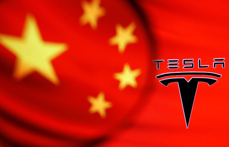 &copy; Reuters. FILE PHOTO: Chinese flag and Tesla logo is seen through a magnifier in this illustration taken January 7, 2021. REUTERS/Dado Ruvic/Illustration/File Photo