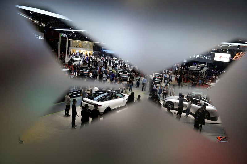 &copy; Reuters. People visit at the XPeng Motors booth at the Auto Shanghai show, in Shanghai, China, April 19, 2023. REUTERS/Aly Song/File photo