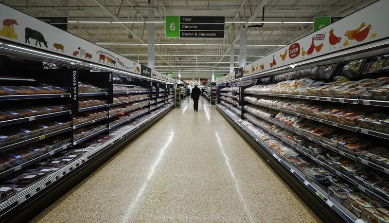 &copy; Reuters. FILE PHOTO: A shopper walks through the meat section at the Asda superstore in High Wycombe, Britain, February 8, 2017.  REUTERS/Eddie Keogh/File Photo