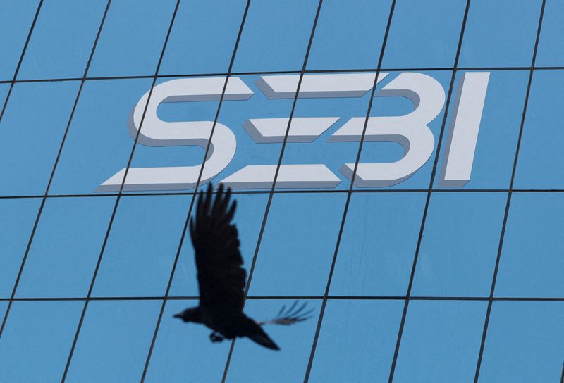 &copy; Reuters. FILE PHOTO: A bird flies past the new logo of the Securities and Exchange Board of India (SEBI) at its headquarters in Mumbai, India, April 19, 2023. REUTERS/Francis Mascarenhas/File Photo