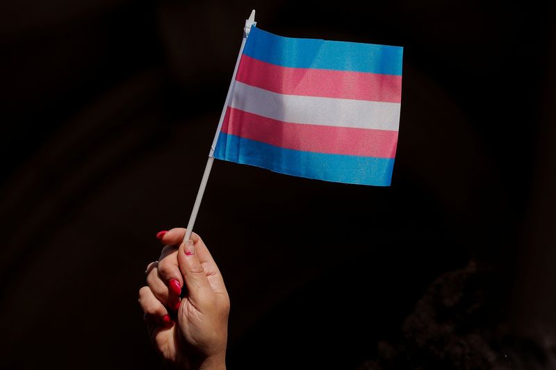 &copy; Reuters. FILE PHOTO: A person holds up a flag during rally to protest the Trump administration's reported transgender proposal to narrow the definition of gender to male or female at birth, at City Hall in New York City, U.S., October 24, 2018. REUTERS/Brendan McD