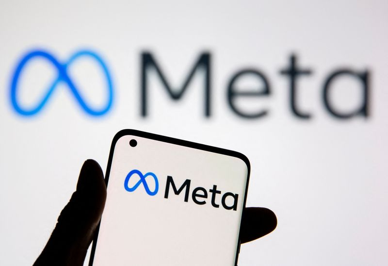 &copy; Reuters. FILE PHOTO: A smartphone with Meta logo is seen in front of displayed Facebook's new rebrand logo Meta in this illustration taken, October 28, 2021. REUTERS/Dado Ruvic/Illustration/File Photo