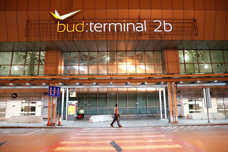 &copy; Reuters. A man walks in front of Budapest Airport's terminal 2B, Hungary, August 15, 2018 after one terminal of the airport and its surroundings were briefly shut down as the Disaster Management Authority ordered an investigation due to an overheated container car