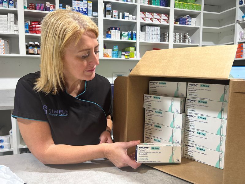 &copy; Reuters. FILE PHOTO: A Simple Online Pharmacy weight care provider unpacks Wegovy stock, at the Simple Online Pharmacy Headquarters, in Glasgow, Britain, September 5, 2023. Simple Online Pharmacy/Handout via REUTERS  