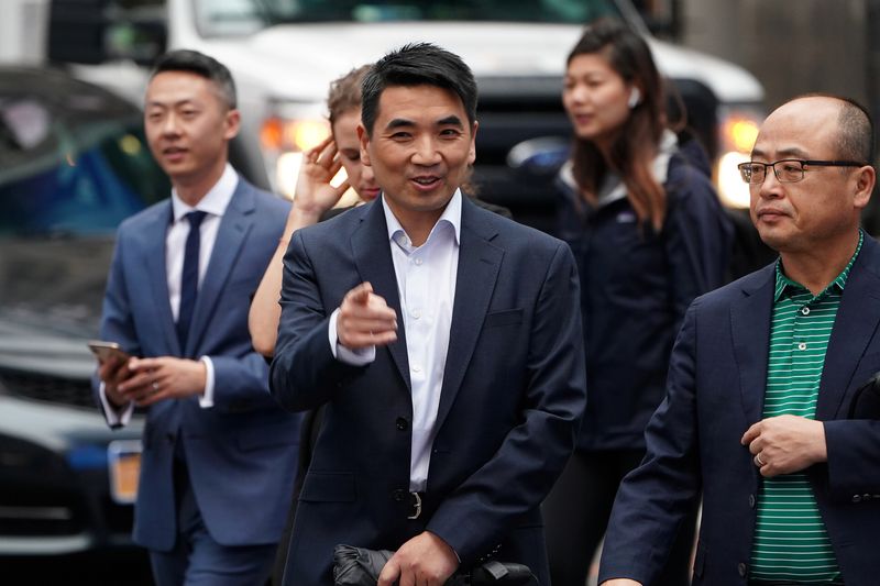 &copy; Reuters. FILE PHOTO: Eric Yuan, CEO of Zoom Video Communications walks on the street as he takes part in a bell ringing ceremony at the NASDAQ MarketSite in New York, New York, U.S., April 18, 2019.  REUTERS/Carlo Allegri/File Photo