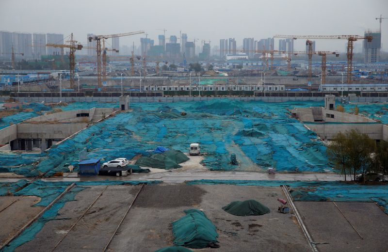 &copy; Reuters. FILE PHOTO: Construction sites are seen next to Zhengzhou East Railway Station in Zhengzhou, Henan province, China November 29, 2019. REUTERS/Jason Lee/File Photo