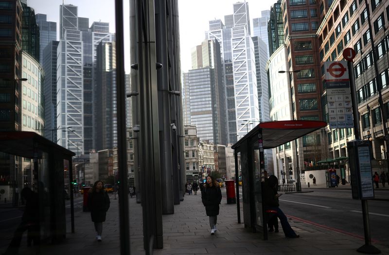 &copy; Reuters. A person walks through the City of London financial district in London, Britain, February 10, 2023. REUTERS/Henry Nicholls/file photo