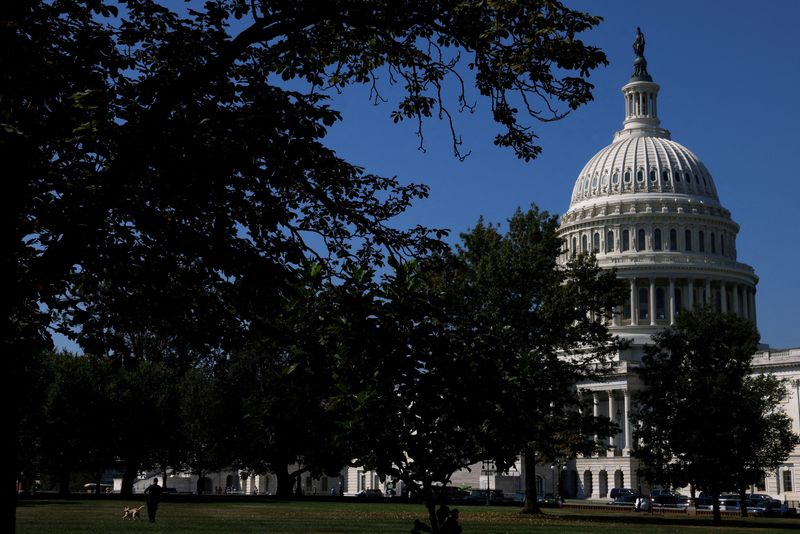 &copy; Reuters. FILE PHOTO: A U.S. Capitol Police Officer walks a K-9 dog in front of the Capitol amid talks over government funding, as the threat of an October government shutdown looms on Capitol Hill in Washington, U.S., September 6, 2023. REUTERS/Julia Nikhinson/Fil