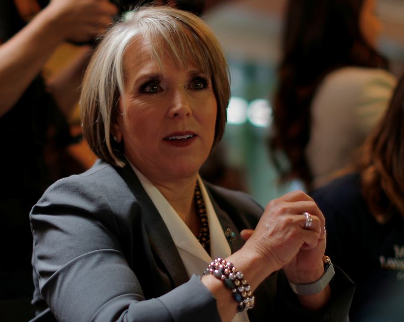 &copy; Reuters. FILE PHOTO: Democratic candidate for governor Michelle Lujan Grisham sits down for a meal at Barelas Coffee House on midterm elections day in Albuquerque, New Mexico, U.S., November 6, 2018.   REUTERS/Brian Snyder