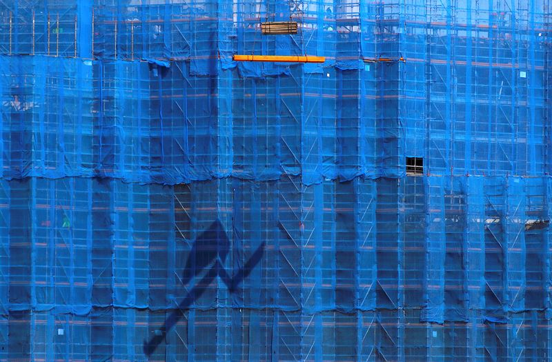 &copy; Reuters. A crane lifts building materials in front of scaffolding at a construction site in central Sydney, Australia, September 11, 2018.    REUTERS/David Gray/file photo
