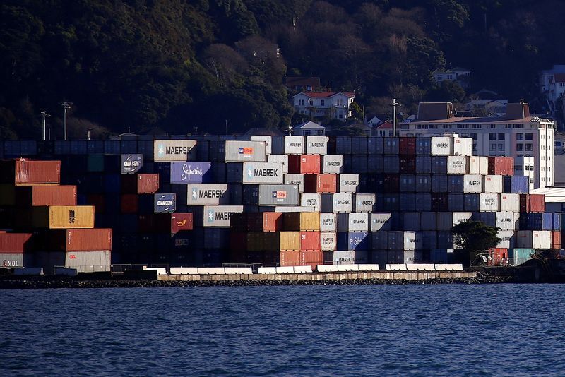 &copy; Reuters. FILE PHOTO: Containers sit stacked at a port terminal with residential houses behind in Wellington, New Zealand, July 2, 2017. REUTERS/David Gray/File Photo