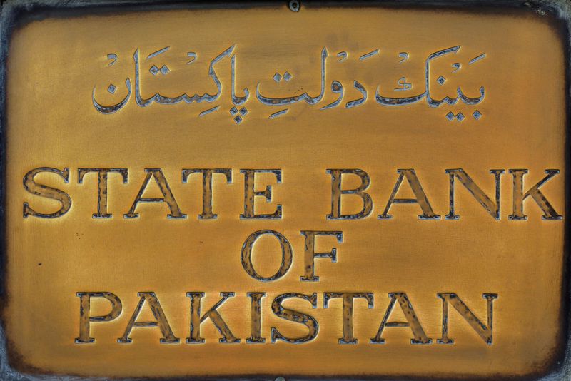 &copy; Reuters. FILE PHOTO: A brass plaque of the State Bank of Pakistan is seen outside of its wall in Karachi, Pakistan December 5, 2018. REUTERS/Akhtar Soomro/File Photo