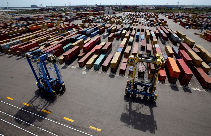 &copy; Reuters. FILE PHOTO: Cranes move shipping containers stacked along the dockside at the Seayard Co. terminal, operated by the Marseille-Fos port authority in Fos sur Mer, France, April 20, 2016.    REUTERS/Jean-Paul Pelissier//File Photo