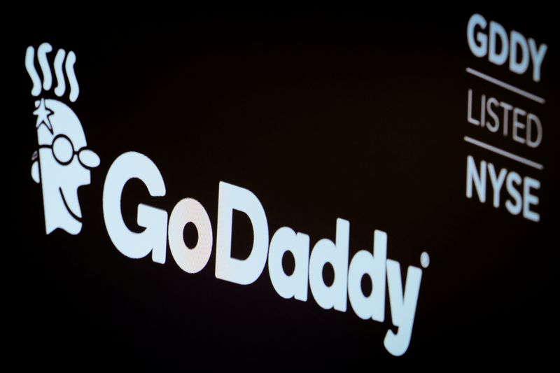 &copy; Reuters. The company logo and ticker for GoDaddy Inc. is displayed on a screen on the floor of the New York Stock Exchange (NYSE) in New York, U.S., March 4, 2019. REUTERS/Brendan McDermid/File photo