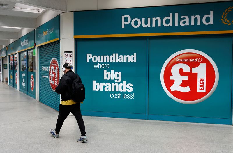 &copy; Reuters. A man walks past a Poundland store in London, Britain, April 16 2023.  REUTERS/Peter Nicholls/File photo