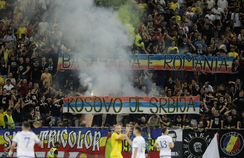 &copy; Reuters. Soccer Football - Euro 2024 Qualifier - Group I - Romania v Kosovo - National Arena, Bucharest, Romania - September 12, 2023 Romania fans inside the stadium hold up banners which subsequently suspends play Inquam Photos via REUTERS/George Calin 