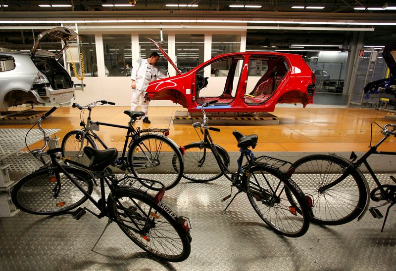&copy; Reuters. FILE PHOTO: Bicycles are parked beside the production line while an employee works on a Volkswagen Golf car at the Volkswagen headquarters in Wolfsburg February 15, 2007. REUTERS/Christian Charisius/File Photo     