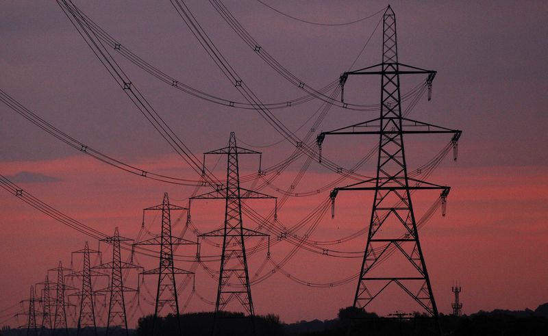 &copy; Reuters. The sun rises behind electricity pylons near Chester, northern England October 24, 2011. REUTERS/Phil Noble/File photo