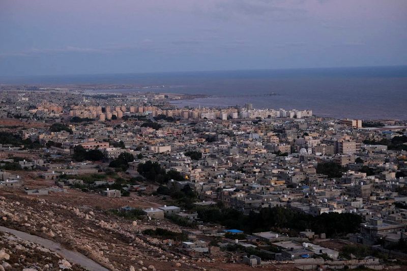 Libya flood survivors pick through ruins in search of missing thousands