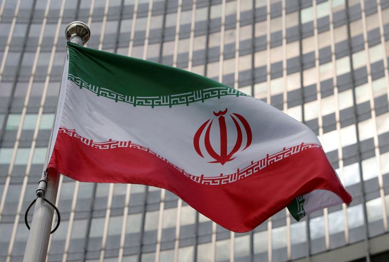 &copy; Reuters. FILE PHOTO: The Iranian flag flutters in front of the International Atomic Energy Agency (IAEA) organisation's headquarters in Vienna, Austria, June 5, 2023. REUTERS/Leonhard Foeger//File Photo