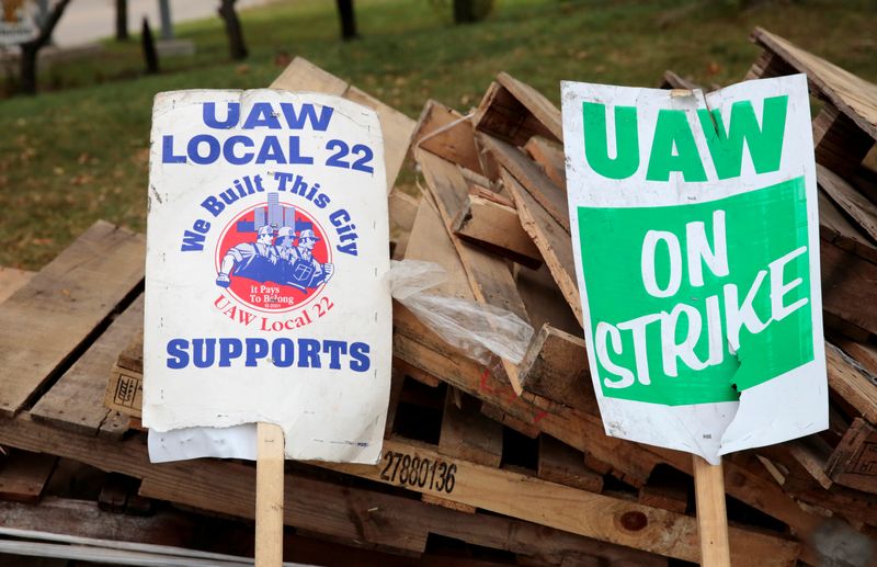 &copy; Reuters. FILE PHOTO: "UAW on strike" signs lean against a pile of wood on the picket line outside the General Motors Detroit-Hamtramck Assembly in Hamtramck, Michigan, U.S. October 25, 2019.   REUTERS/Rebecca Cook/File Photo