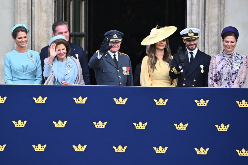 &copy; Reuters. Princess Madeleine, Chris O'Neill, Prince Daniel, Sweden's Queen Silvia, Sweden's King Carl Gustaf, Prince Carl Philip, Prince Daniel and Crown Princess Victoria watch from the balcony during the changing of the guard in the outer courtyard of Stockholm P