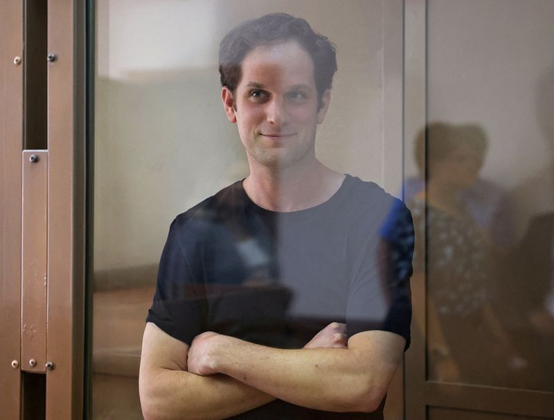 &copy; Reuters. Wall Street Journal reporter Evan Gershkovich, who was arrested in March while on a reporting trip and accused of espionage, stands behind a glass wall of an enclosure for defendants before a court hearing to consider an appeal against his detention, in M