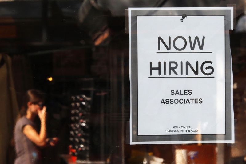 &copy; Reuters. FILE PHOTO: A "Now Hiring" sign hangs on the door to the Urban Outfitters store at Quincy Market in Boston, Massachusetts September 5, 2014.   REUTERS/Brian Snyder   