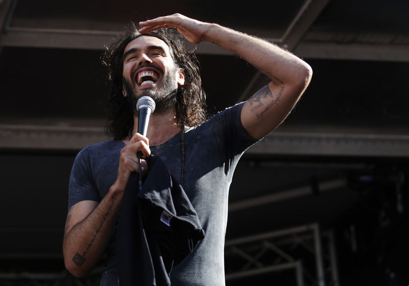 &copy; Reuters. FILE PHOTO-Comedian and presenter Russell Brand speaks during an anti-austerity rally in Parliament Square in London June 21, 2014.  REUTERS/Luke MacGregor/File Photo