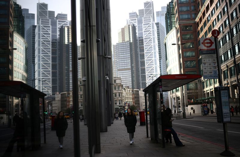 &copy; Reuters. A person walks through the City of London financial district in London, Britain, February 10, 2023. REUTERS/Henry Nicholls/File photo