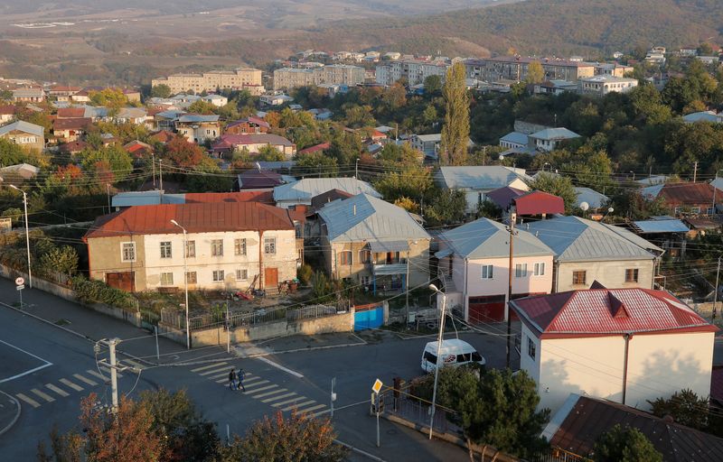 &copy; Reuters. FILE PHOTO: People cross a street in Stepanakert, the capital of the breakaway region of Nagorno-Karabakh, October 19, 2020. REUTERS/Stringer/File Photo