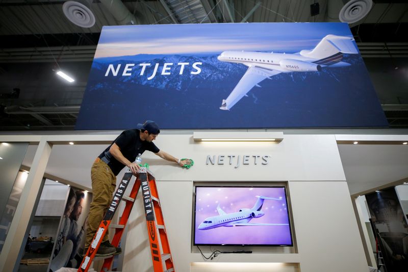 &copy; Reuters. A worker cleans a NetJets booth on the trade show floor, in preparation for the NBAA Business Aviation Convention & Exhibition at the Las Vegas Convention Center, in Las Vegas, Nevada, U.S., October 11, 2021.  REUTERS/Steve Marcus