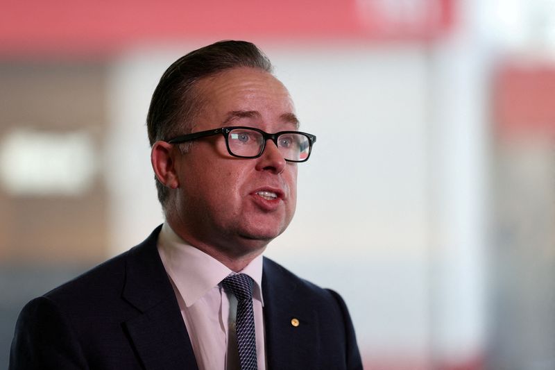&copy; Reuters. FILE PHOTO: Alan Joyce, Chief Executive Officer of Qantas, speaks with members of the media at an event celebrating Qantas' 100th birthday at Sydney Airport in Sydney, Australia, November 16, 2020.  REUTERS/Loren Elliott/File Photo