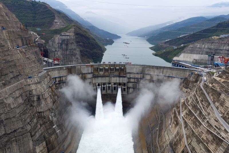 © Reuters. FILE PHOTO: The Baihetan hydropower plant is seen in operation on the border between Qiaojia county of Yunnan province and Ningnan county of Sichuan province, China June 28, 2021. Picture taken with a drone. cnsphoto via REUTERS/File Photo