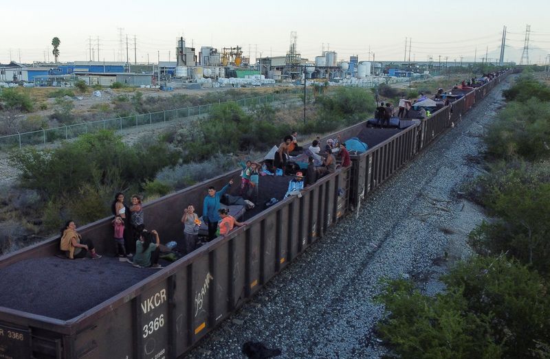 Mexican officials push migrants away from border-bound cargo trains