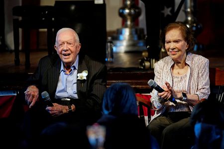 Former President Jimmy Carter rides through Georgia peanut fest By Reuters