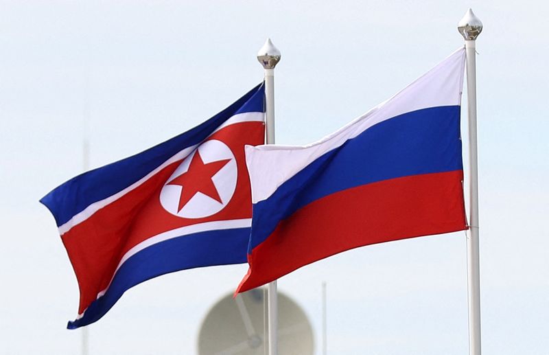 © Reuters. FILE PHOTO: Russian and North Korean flags fly at the Vostochny Сosmodrome, the venue of the meeting between Russia's President Vladimir Putin and North Korea's leader Kim Jong Un, in the far eastern Amur region, Russia, September 13, 2023. Sputnik/Artem Geodakyan/Pool via REUTERS 