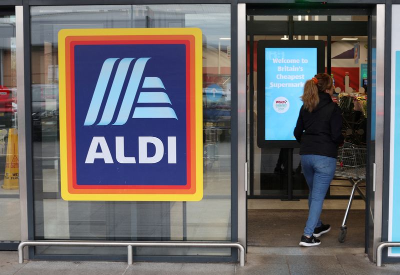 &copy; Reuters. FILE PHOTO: A shopper walks inside an ALDI supermarket near Altrincham, Britain, February 20, 2023. REUTERS/Phil Noble/File Photo